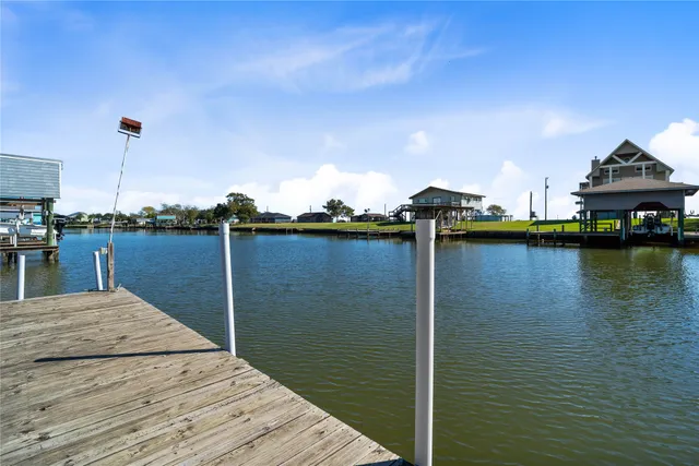 a view of swimming pool with seating space and deck