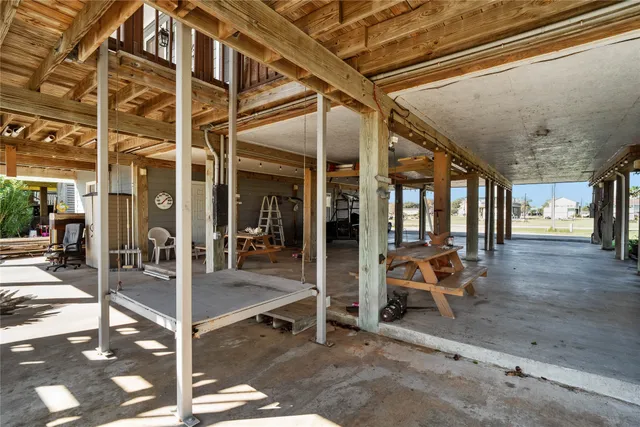 an aerial view of a residential houses with outdoor space