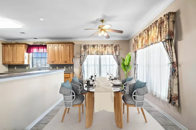 a kitchen with granite countertop stainless steel appliances a refrigerator and cabinets
