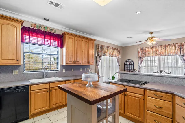 a kitchen with a refrigerator and cabinets