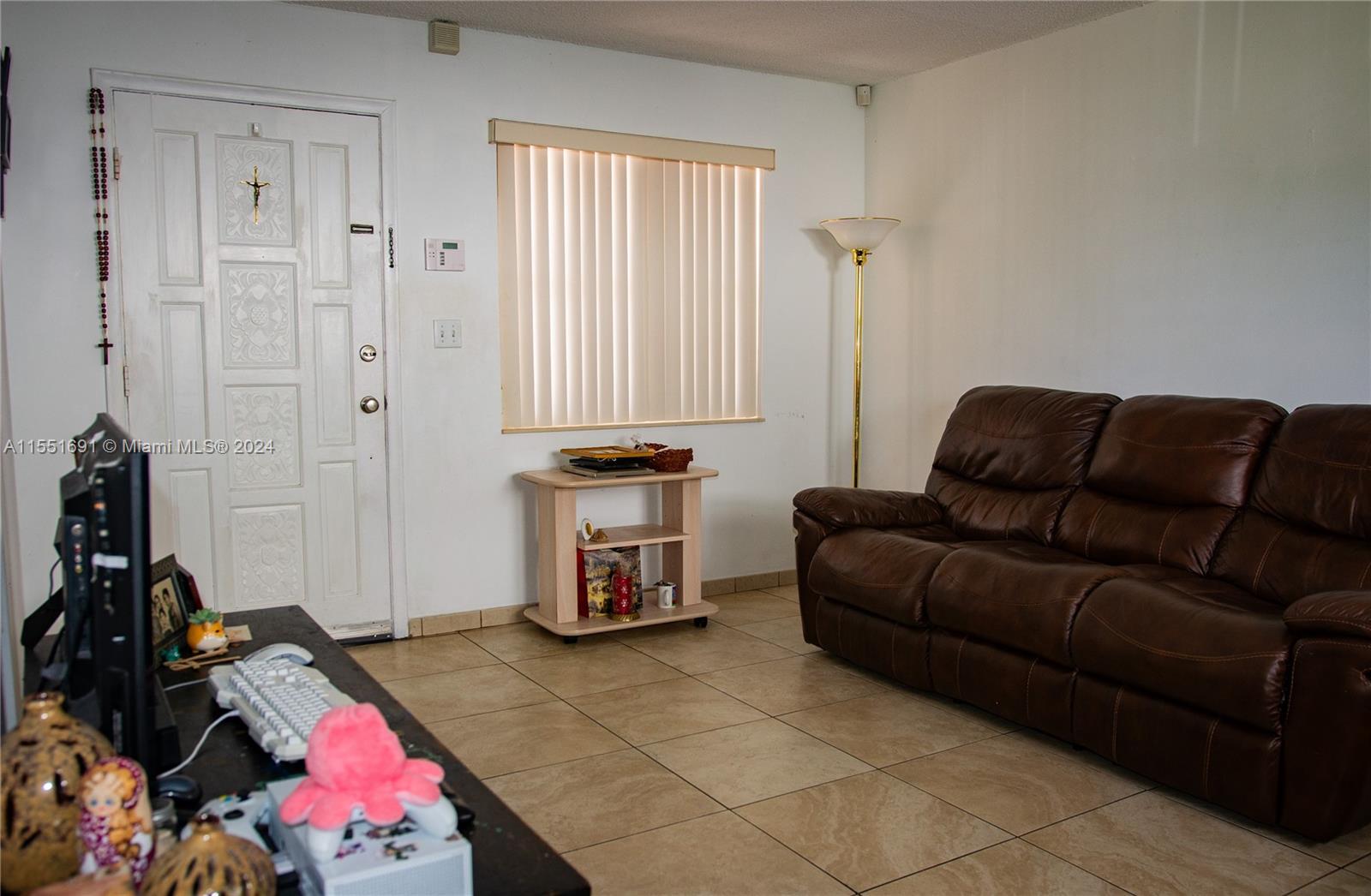 6005 Southwest 22nd Street Miami, FL 33155 - Photo 11 of 36 a living room with furniture and a window