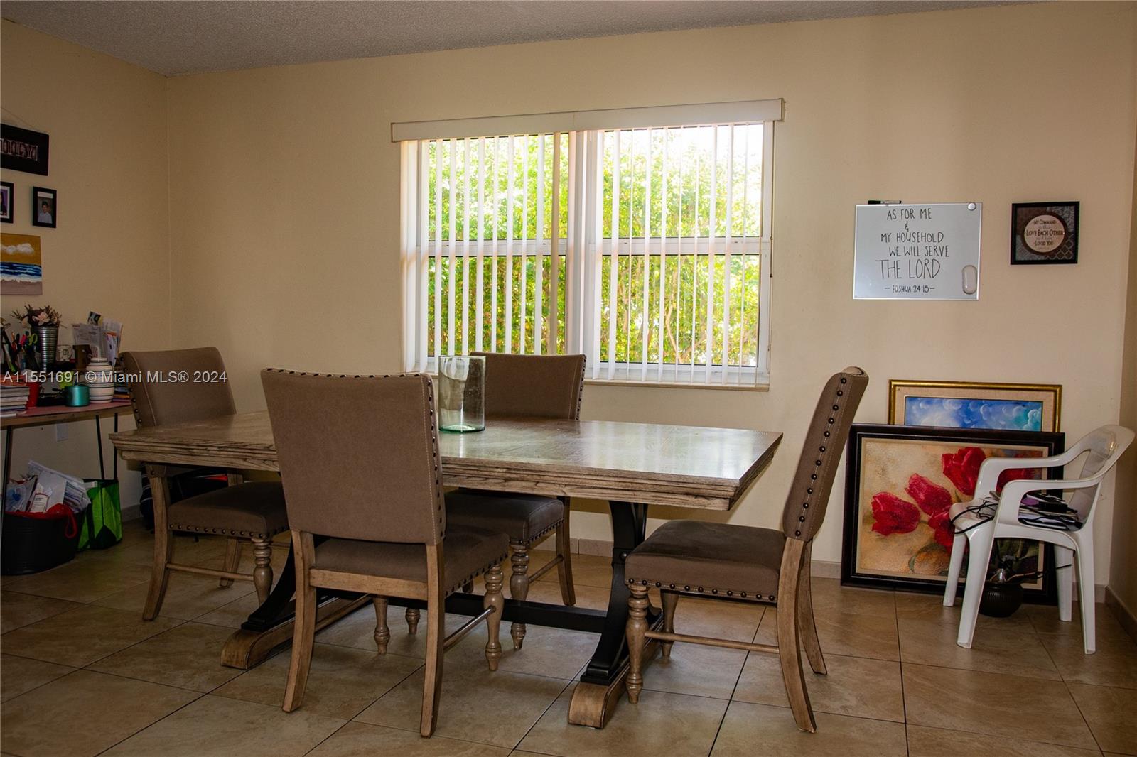 6005 Southwest 22nd Street Miami, FL 33155 - Photo 17 of 36 a view of a dining room with furniture and a window