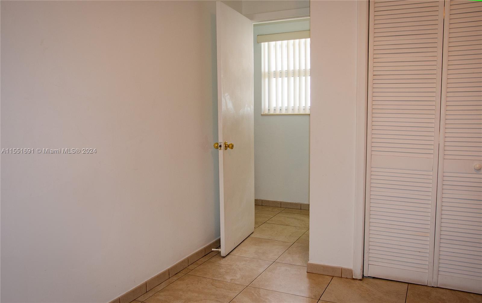 6005 Southwest 22nd Street Miami, FL 33155 - Photo 22 of 36 a view of an empty room with an entryway