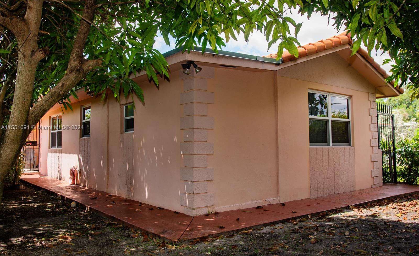 6005 Southwest 22nd Street Miami, FL 33155 - Photo 3 of 36 a view of a house with a yard