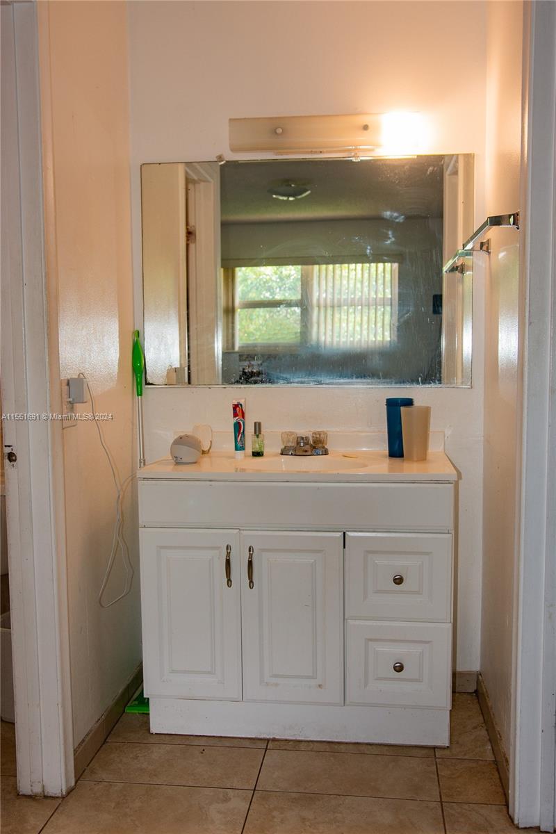 6005 Southwest 22nd Street Miami, FL 33155 - Photo 31 of 36 a bathroom with a sink and a window