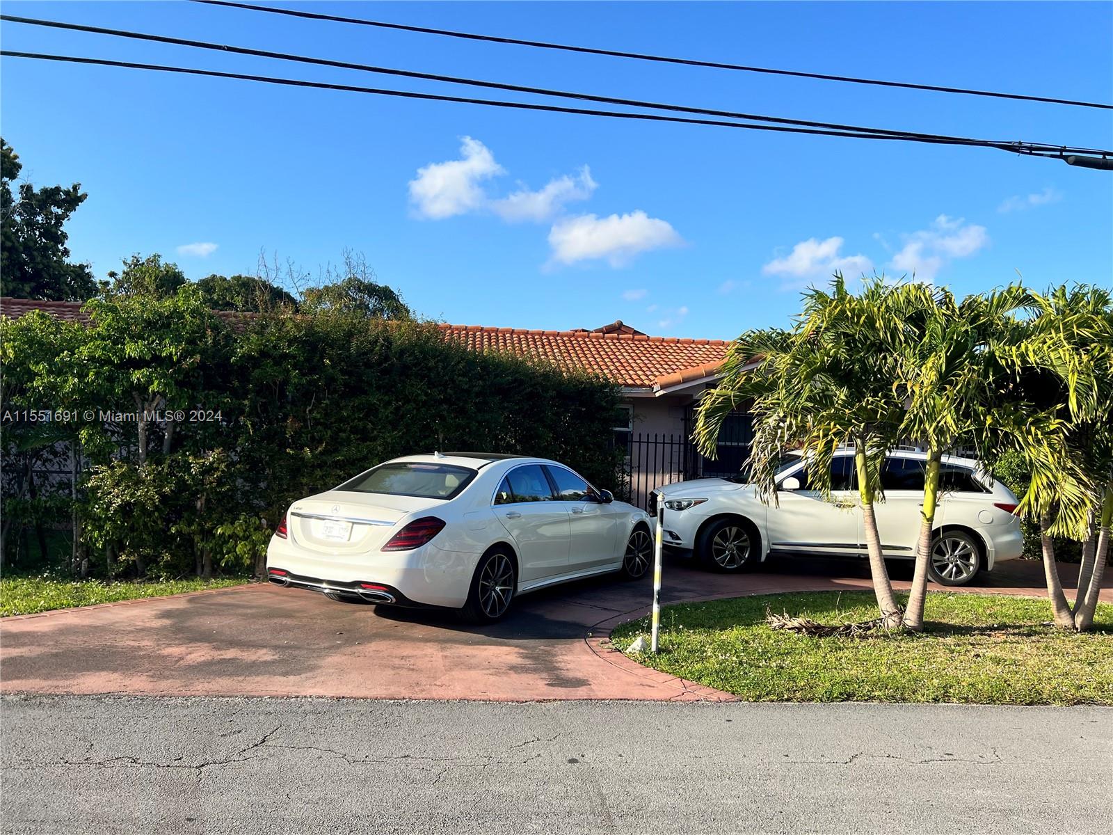 6005 Southwest 22nd Street Miami, FL 33155 - Photo 32 of 36 a view of a car parked in front of a house