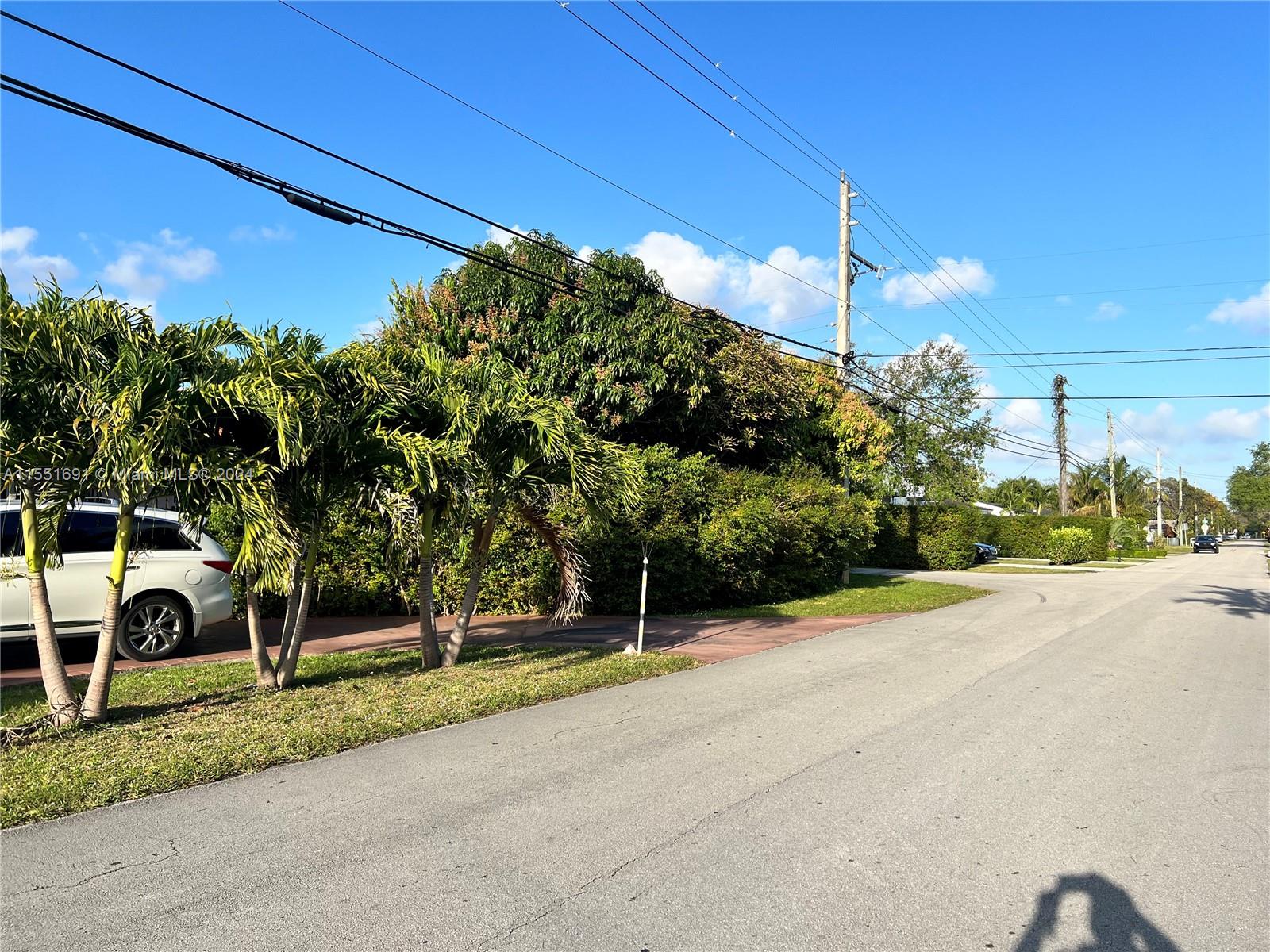 6005 Southwest 22nd Street Miami, FL 33155 - Photo 34 of 36 a view of a house with a yard and tree s