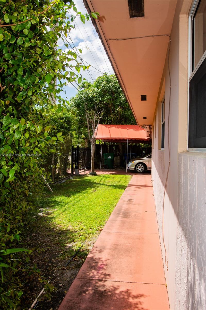 6005 Southwest 22nd Street Miami, FL 33155 - Photo 8 of 36 a front view of a house with a yard