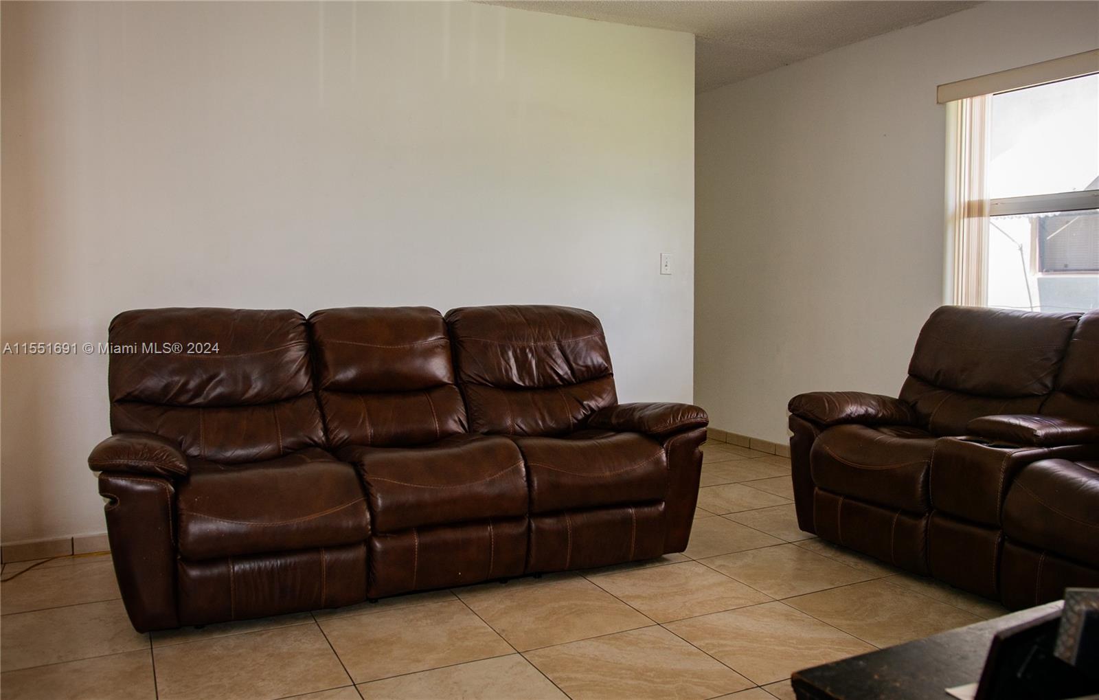 6005 Southwest 22nd Street Miami, FL 33155 - Photo 9 of 36 a living room with couches and a couch