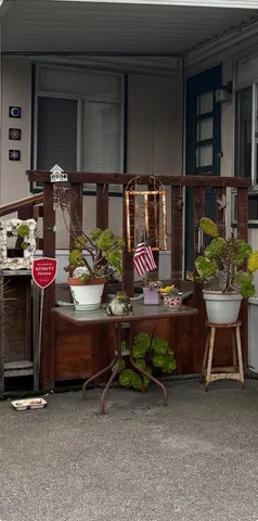 a backyard of a house with yard and outdoor seating
