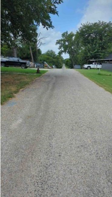 1108 East 8th Street Mount Pleasant, TX 75455 - Photo 5 of 8 a view of a field of grass and trees