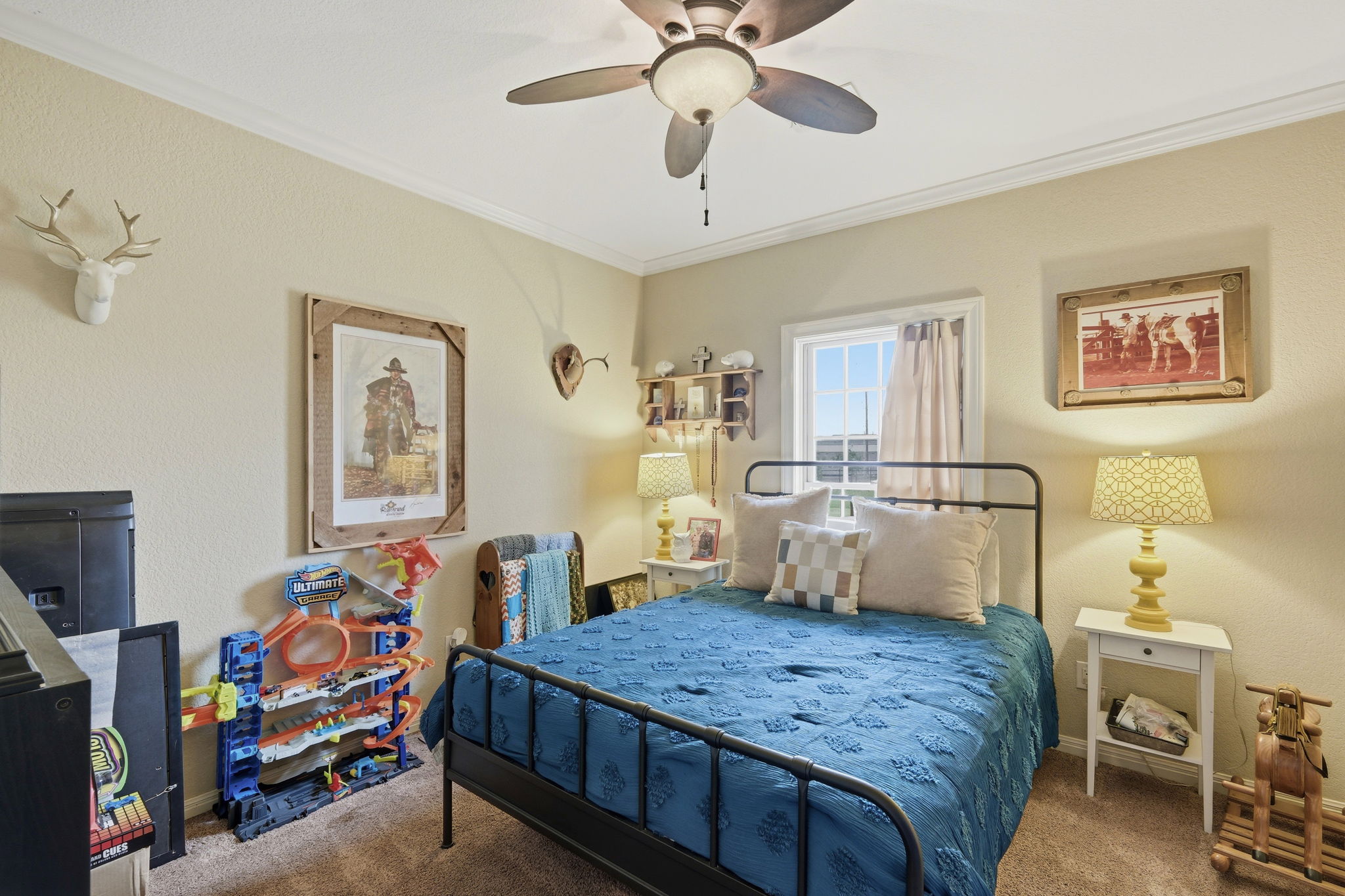 701 County Road 107 Georgetown, TX 78626 - Photo 21 of 30 a bedroom that has a bed and a chandelier