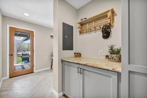 a spacious bedroom with a bed and large windows
