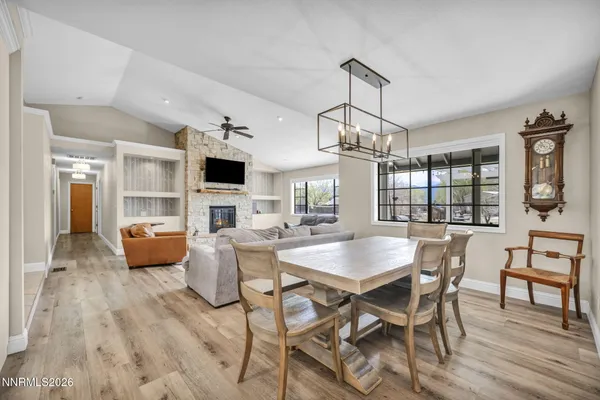 a large kitchen with stainless steel appliances granite countertop a lot of counter space and a sink