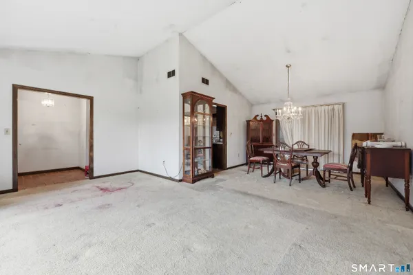 a view of a livingroom with furniture and window