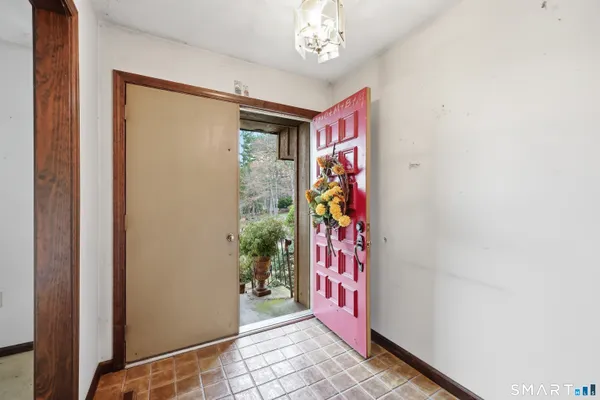 an entryway with a flower pot