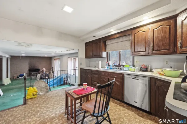 a kitchen with a sink stove and cabinets