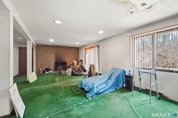 a living room with furniture and a garden