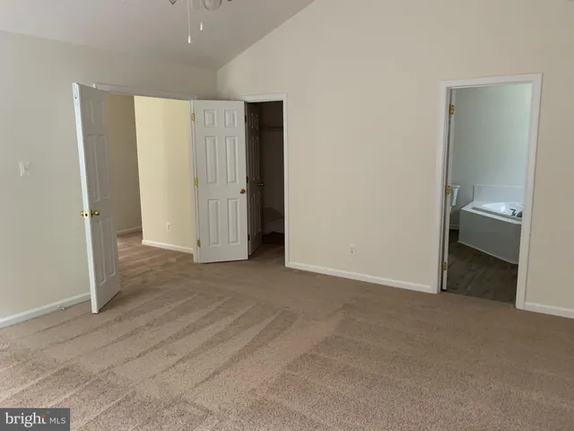 an empty room with a bathroom