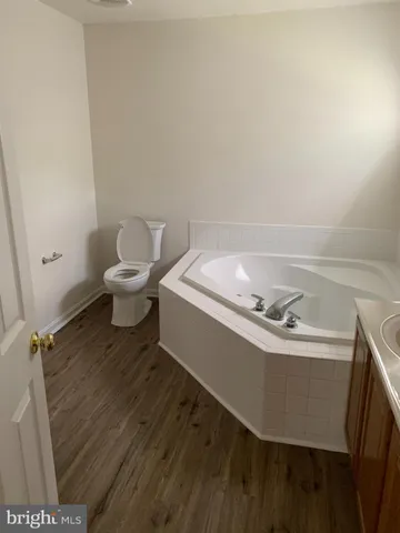 a bathroom with a sink toilet and vanity
