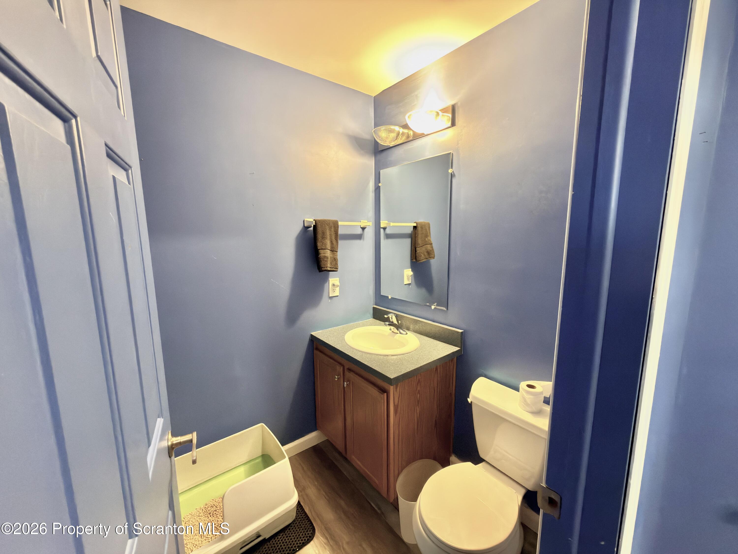 41 South Waterford Road Dalton, PA 18414 - Photo 11 of 22 a bathroom with a toilet sink and mirror