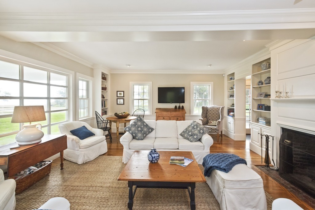 282 King Caesar Road Duxbury, MA 02332 - Photo 18 of 30 a living room with furniture fireplace and a flat screen tv