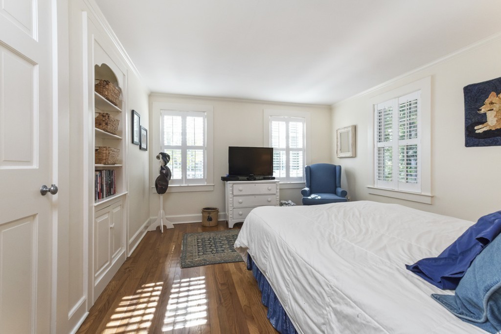 282 King Caesar Road Duxbury, MA 02332 - Photo 25 of 30 a bedroom with a bed a flat screen tv and a window