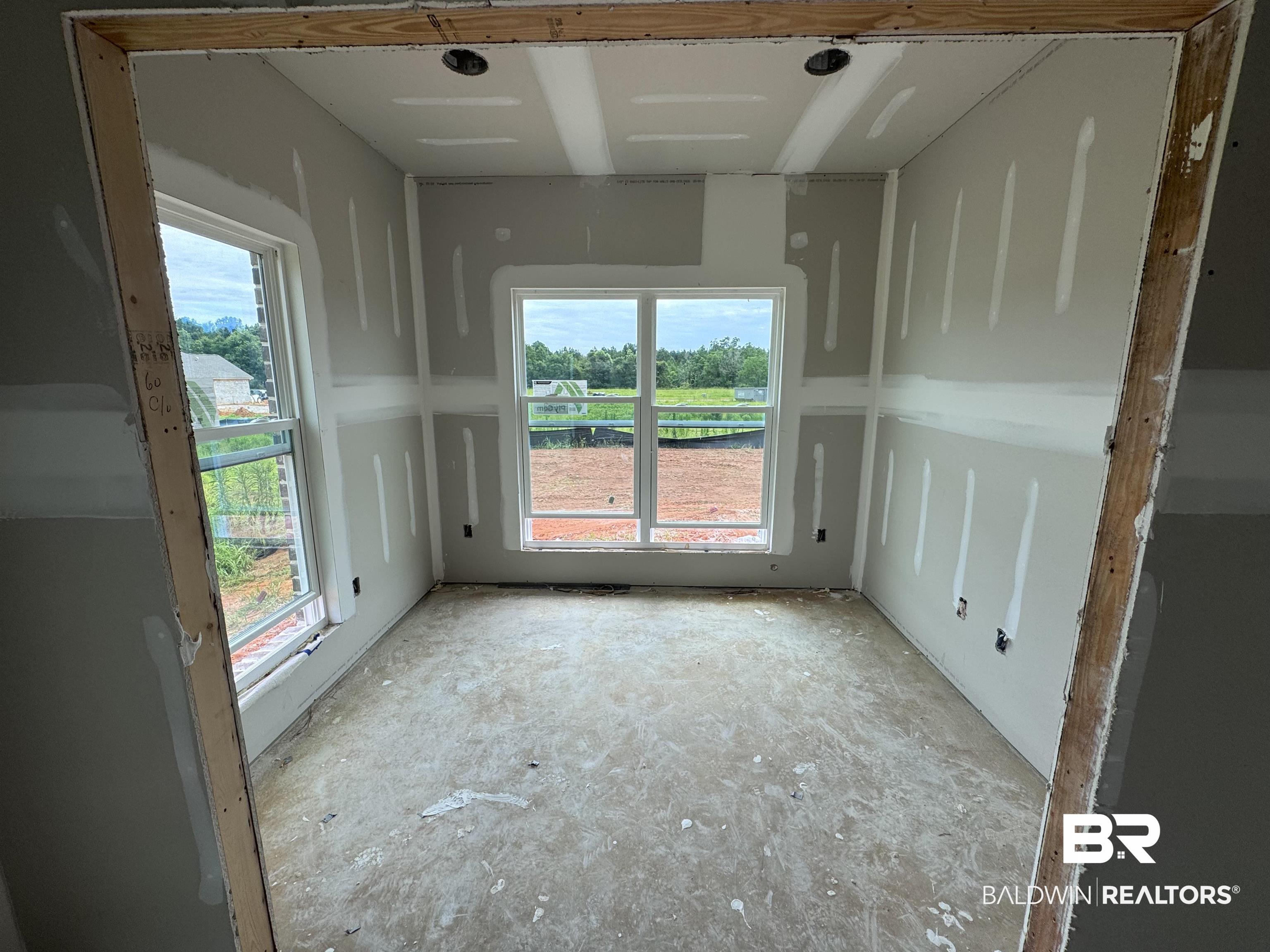 27355 Patch Pl Loop Daphne, AL 36526 - Photo 6 of 17 Room under construction with multiple windows,