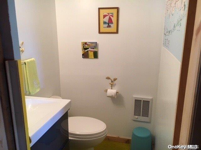 190 Clipper Ocean Beach, NY 11770 - Photo 14 of 21 a bathroom with a toilet and a sink