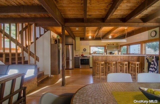 190 Clipper Ocean Beach, NY 11770 - Photo 5 of 21 a living room with furniture and a chandelier