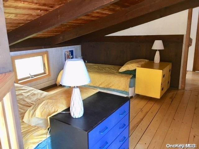 190 Clipper Ocean Beach, NY 11770 - Photo 9 of 21 a room with wooden floor and furniture