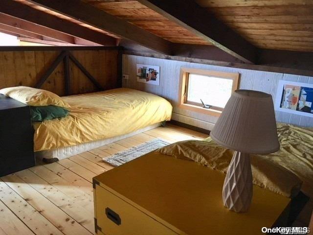 190 Clipper Ocean Beach, NY 11770 - Photo 10 of 21 a bedroom with a bed and a window