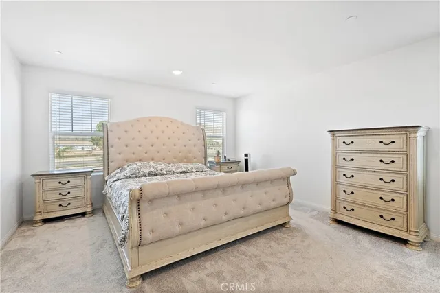 a bedroom with a bed and a cabinets