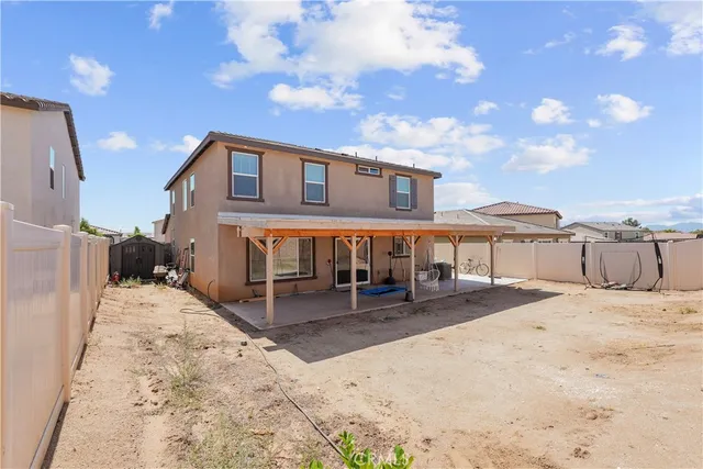 a house with pool in front of it