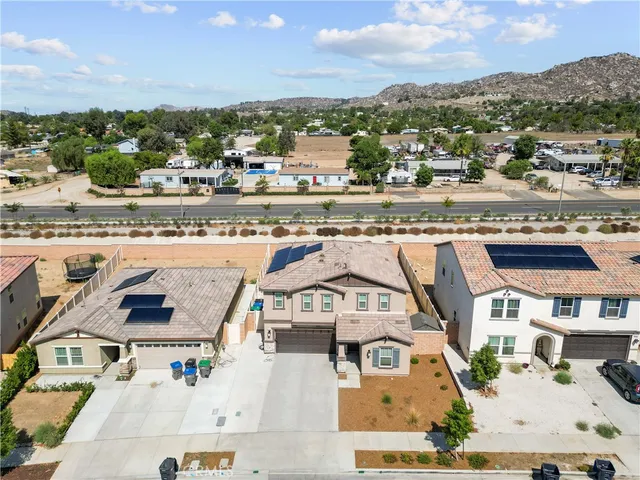 an aerial view of residential houses with outdoor space