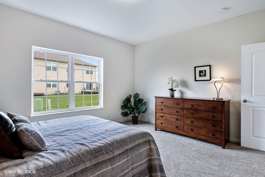 1004 Lexington Street McHenry, IL 60050 - Photo 11 of 20 a bed room with a bed and a window