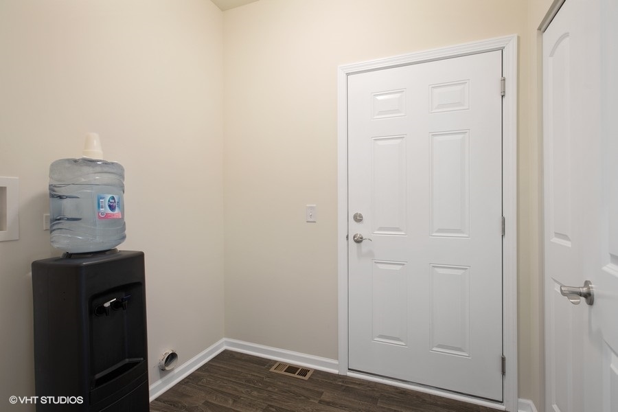 1004 Lexington Street McHenry, IL 60050 - Photo 16 of 20 an empty room with wooden floor and closet