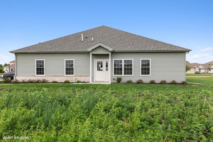 1004 Lexington Street McHenry, IL 60050 - Photo 17 of 20 a front view of house with yard and green space