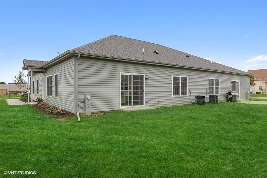 1004 Lexington Street McHenry, IL 60050 - Photo 18 of 20 a view of a house with a yard