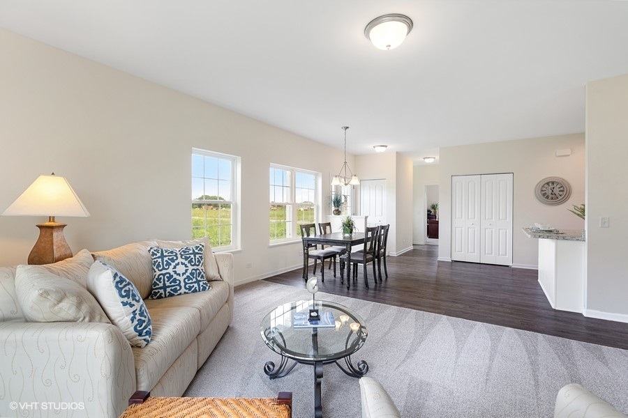 1004 Lexington Street McHenry, IL 60050 - Photo 4 of 20 a living room with furniture and a large window