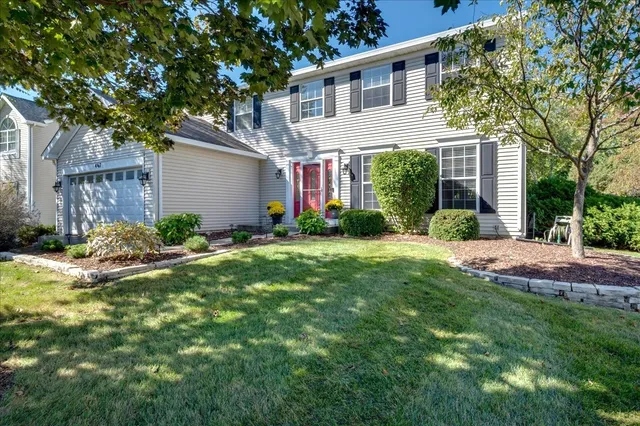 front view of a house with a yard