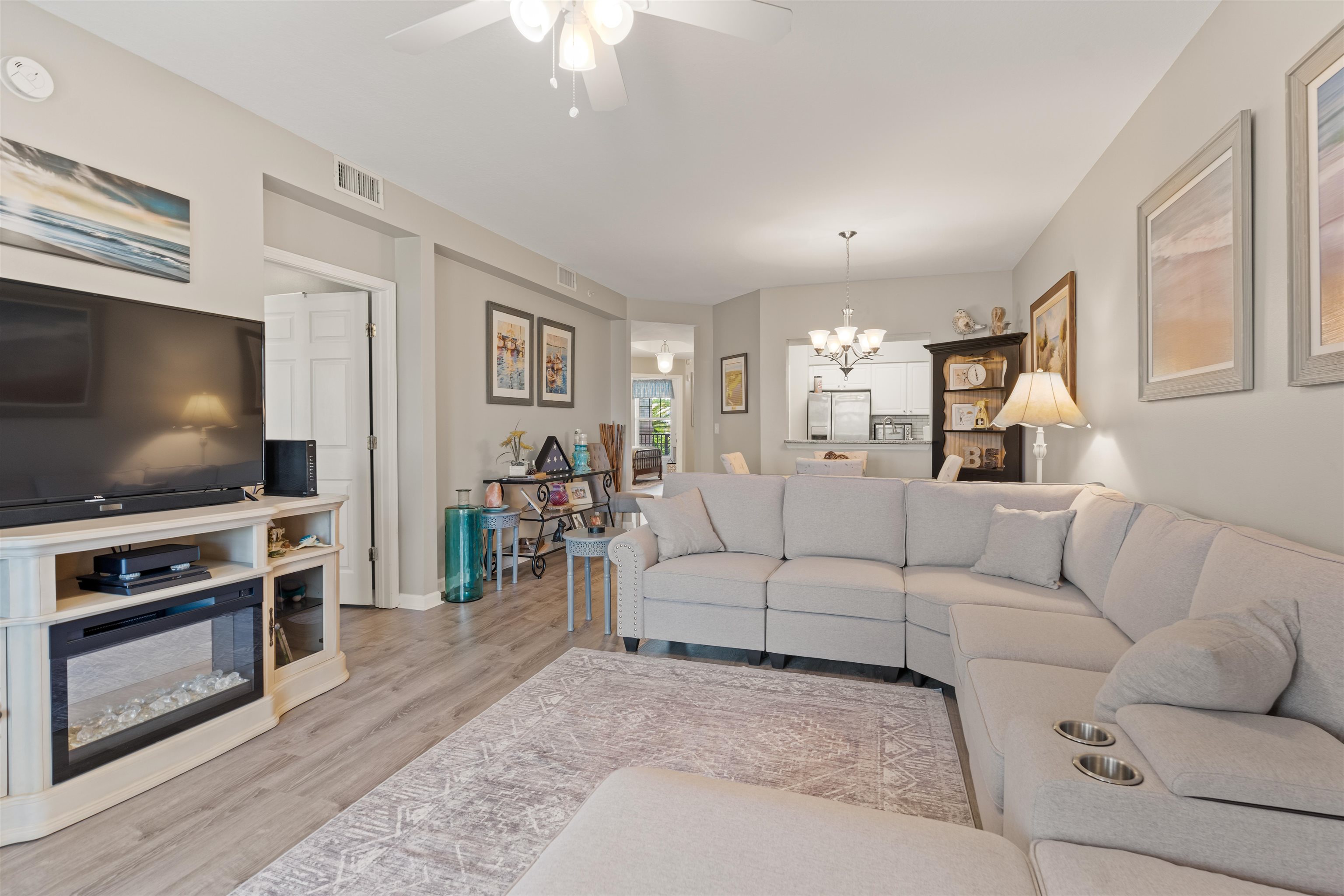 255 Atlantis Circle, Unit D202 St. Augustine Beach, FL 32080 - Photo 15 of 45 a living room with furniture and a flat screen tv