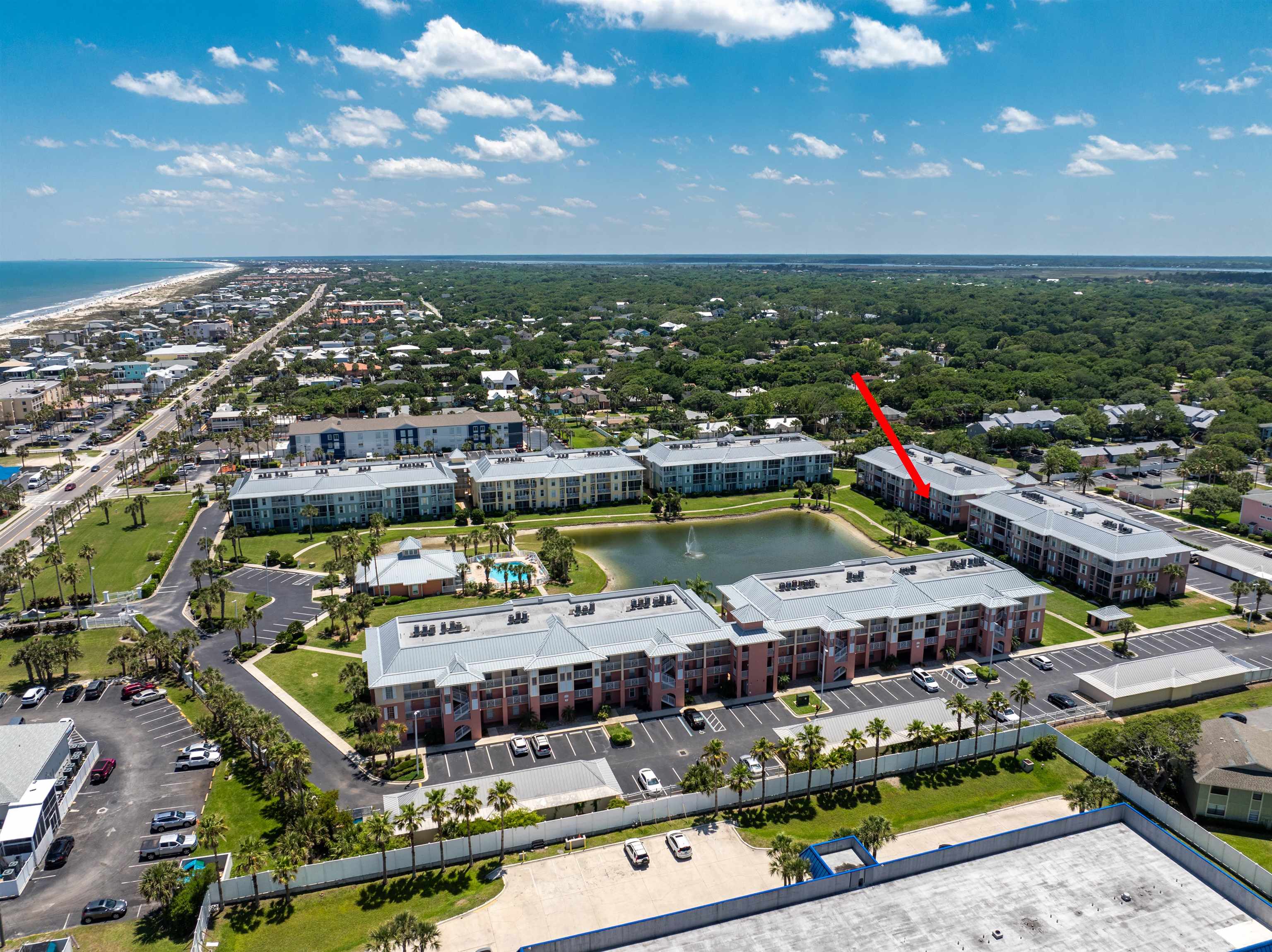 255 Atlantis Circle, Unit D202 St. Augustine Beach, FL 32080 - Photo 38 of 45 an aerial view of a city with lots of residential buildings ocean and mountain view in back