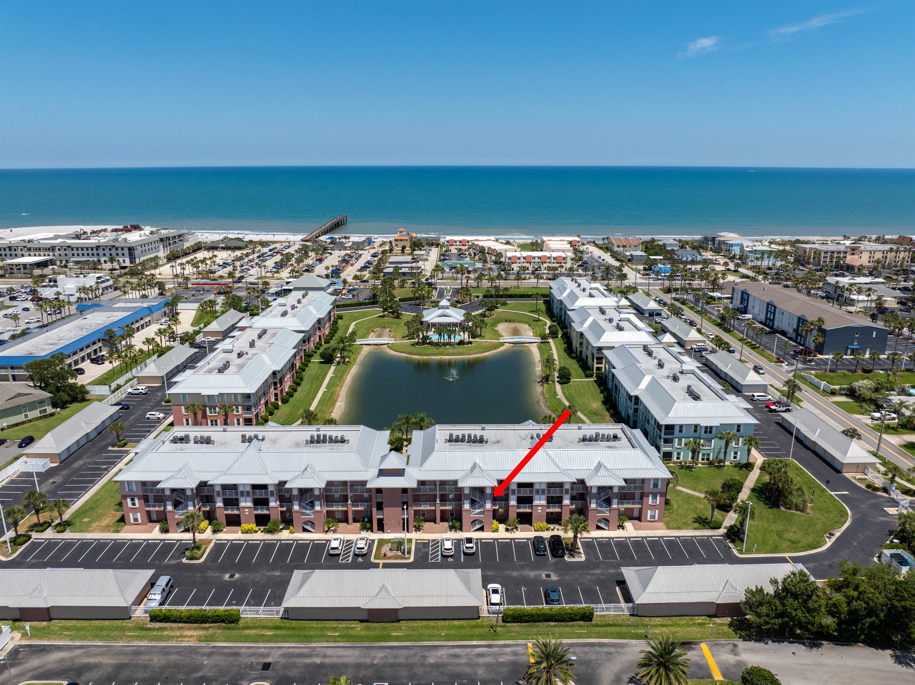 255 Atlantis Circle, Unit D202 St. Augustine Beach, FL 32080 - Photo 43 of 45 an aerial view of multiple houses with yard swimming pool and ocean view
