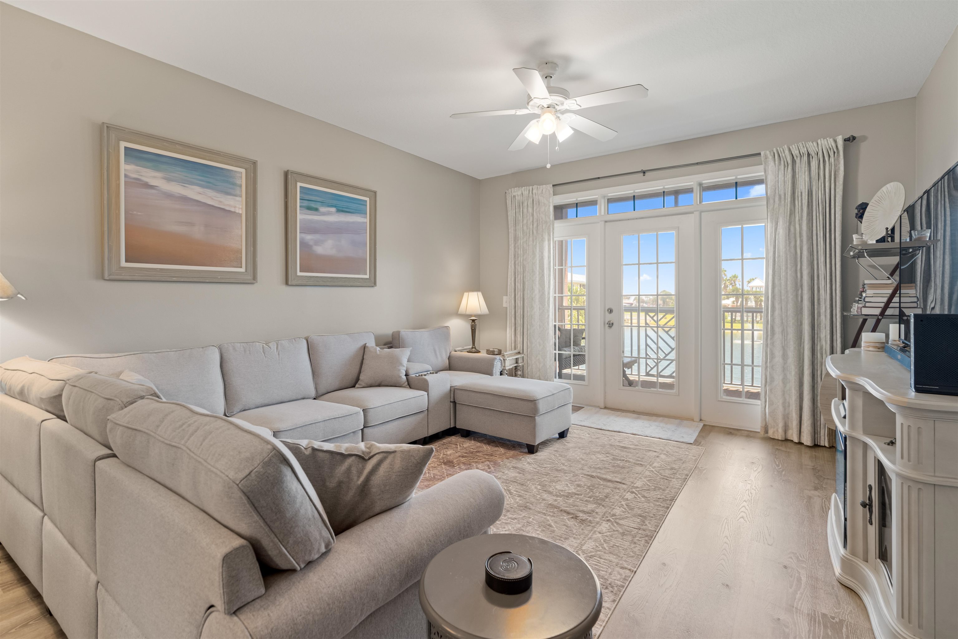 255 Atlantis Circle, Unit D202 St. Augustine Beach, FL 32080 - Photo 5 of 45 a living room with furniture and a flat screen tv