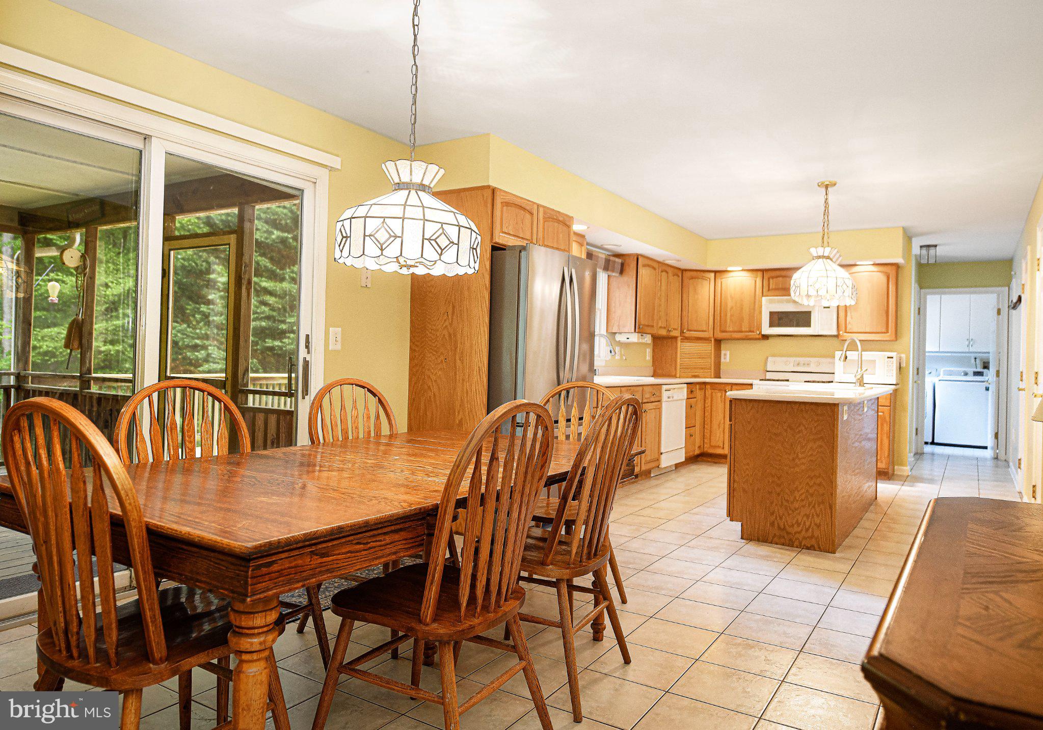 711 Gilbert Road Aberdeen, MD 21001 - Photo 6 of 54 a dining room with furniture and a chandelier