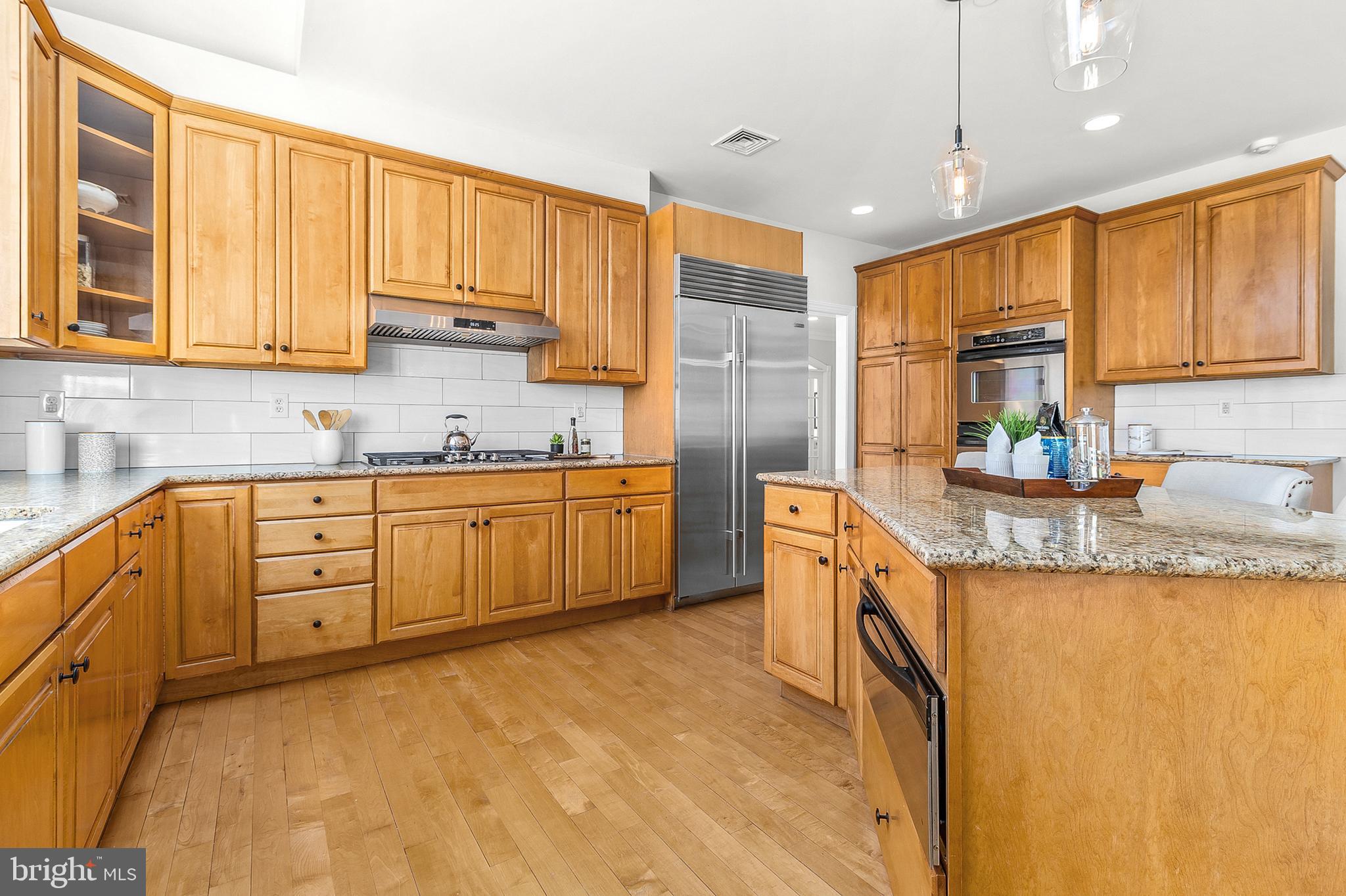 4 Greystone Circle Newtown Square, PA 19073 - Photo 12 of 51 a kitchen with granite countertop a sink a counter space appliances and cabinets