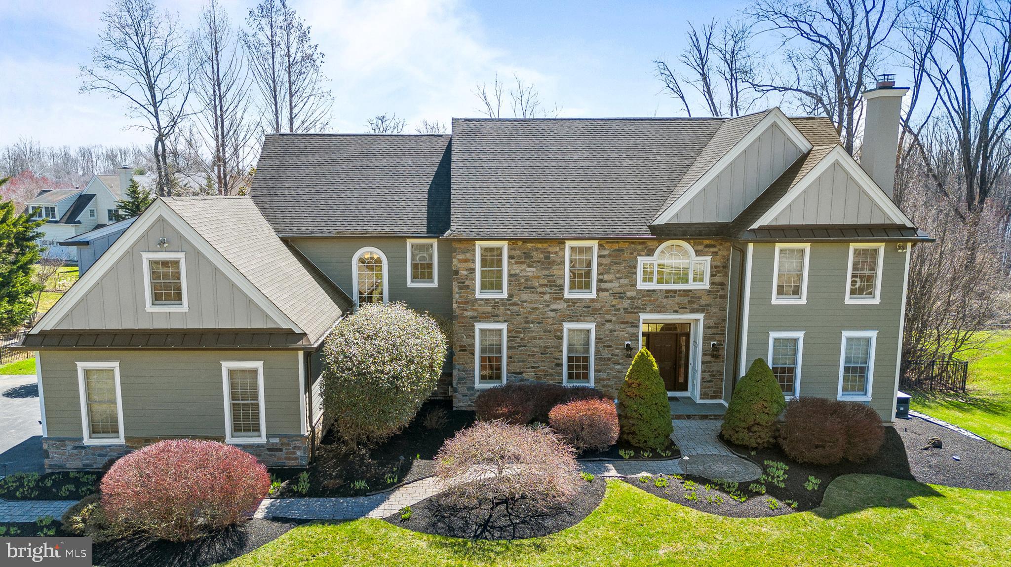 4 Greystone Circle Newtown Square, PA 19073 - Photo 2 of 51 a front view of a house with a yard and garage