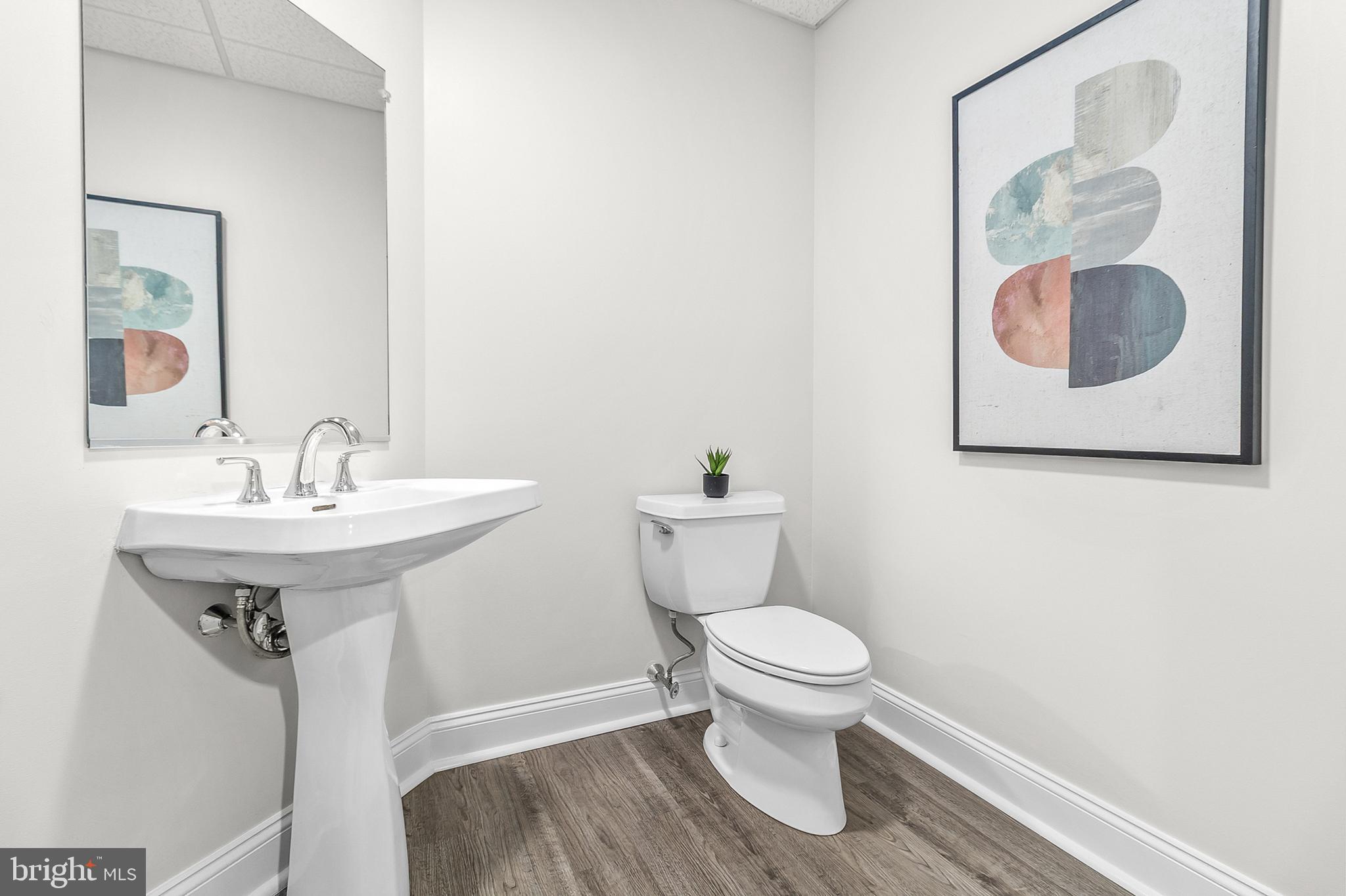 4 Greystone Circle Newtown Square, PA 19073 - Photo 35 of 51 a bathroom with a toilet sink and mirror