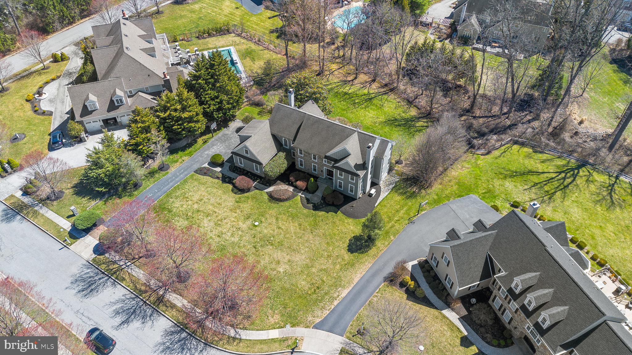 4 Greystone Circle Newtown Square, PA 19073 - Photo 38 of 51 an aerial view of a house with a yard and garden
